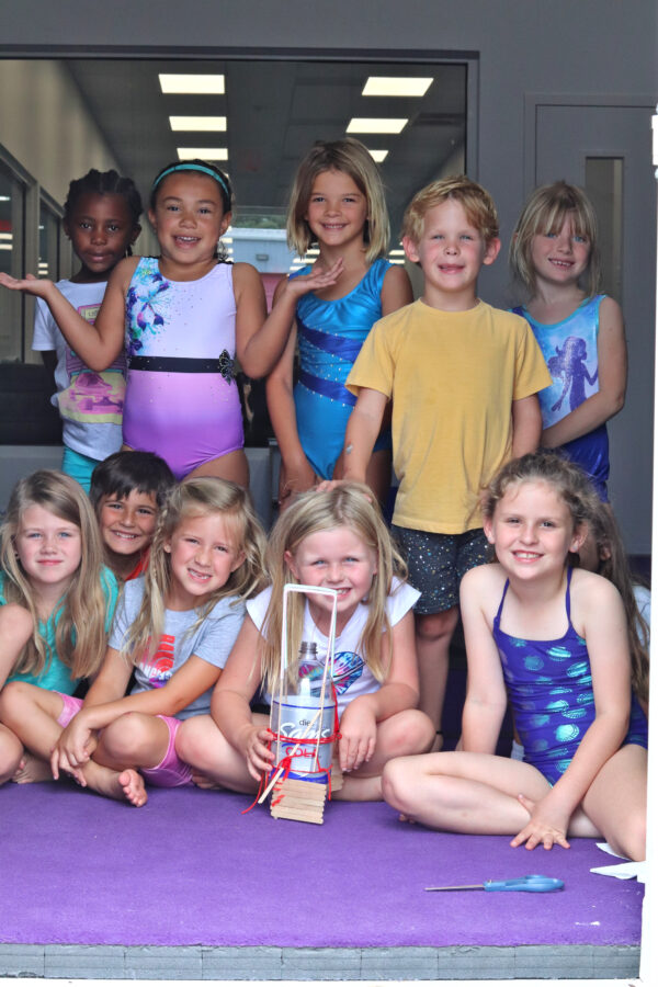 Children enjoying gymnastics camp activities and crafts at Flight Gymnastics
